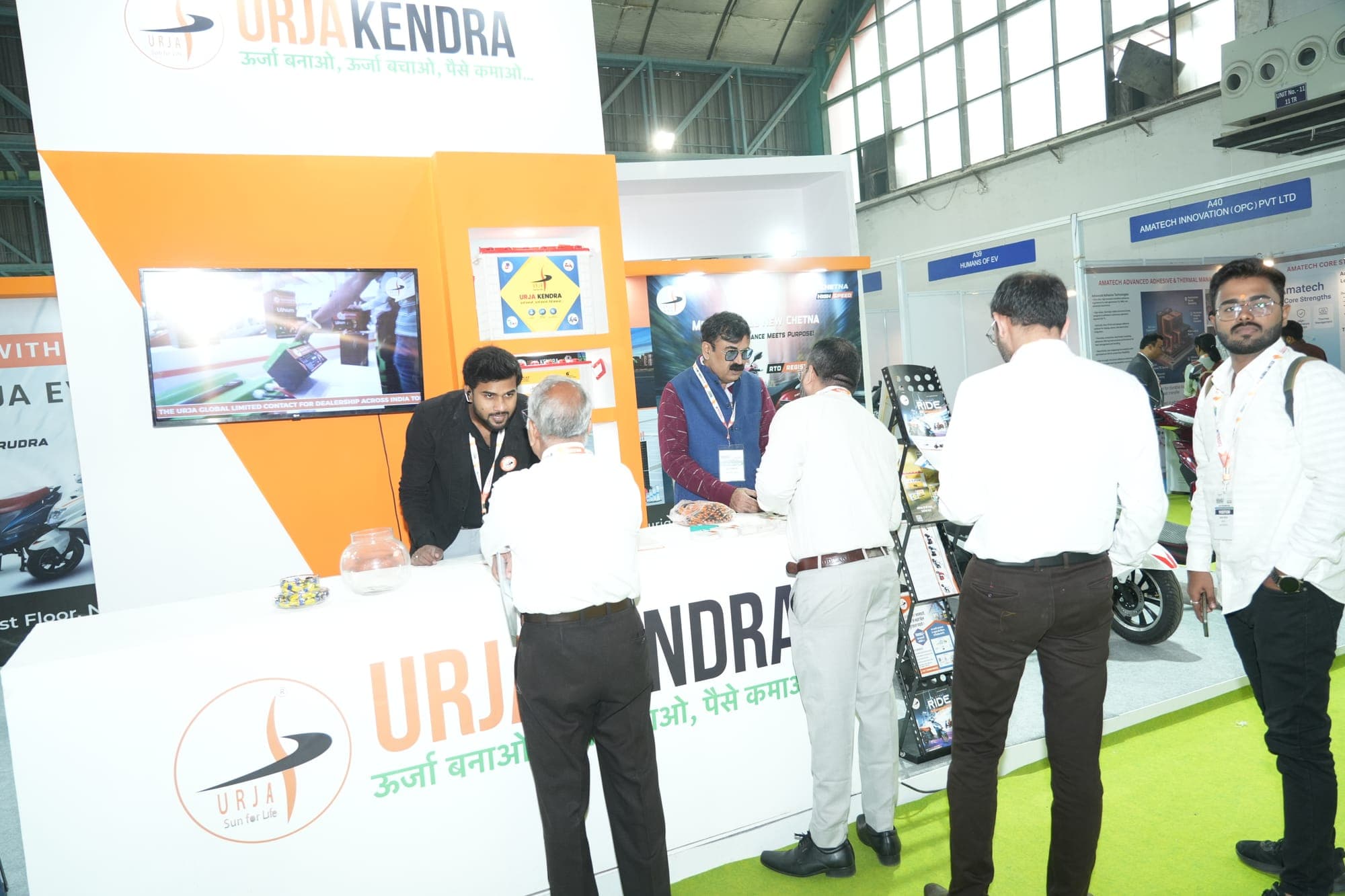 Visitors at an electric-vehicle exhibitor booth at a previous edition of the co-located India EV International Show